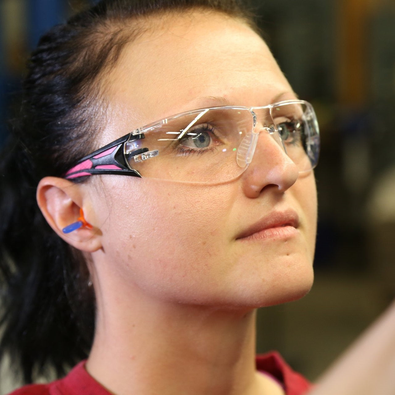 Pyramex Endeavor Plus Safety Glasses Black/Pink Temples with Clear Anti-Fog Lenses worn by worker.