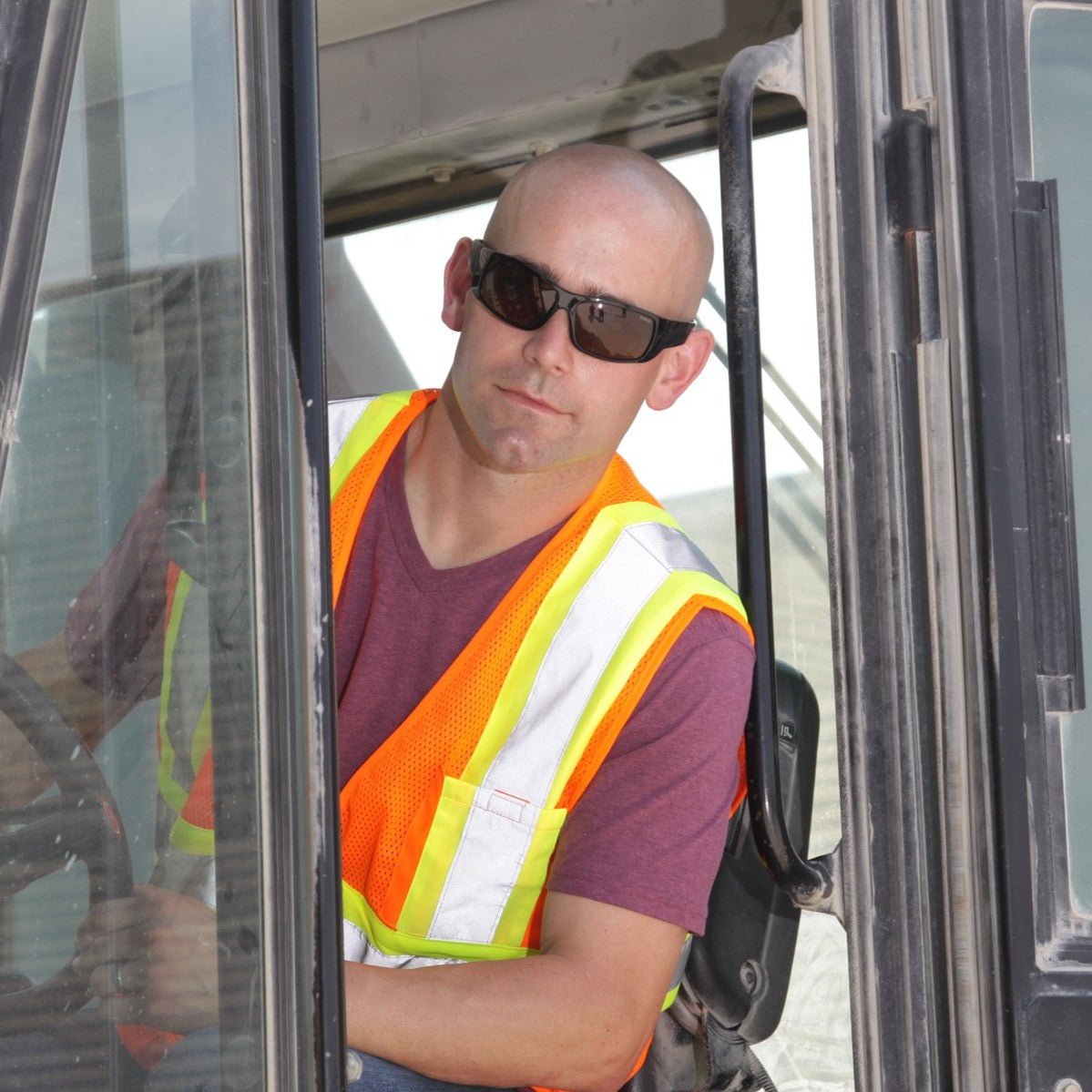 Pyramex Furix Safety Glasses with Black Frame and Gray Anti-Fog Lens worn by construction worker