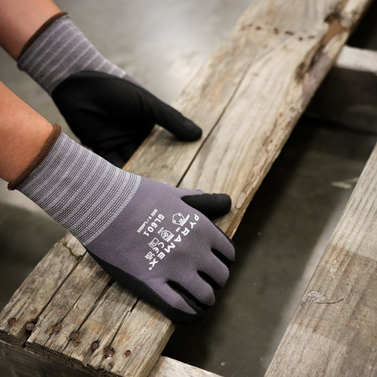 Pyramex GL601 Series Micro-Foam Nitrile Gloves worn while lifting a wood pallet