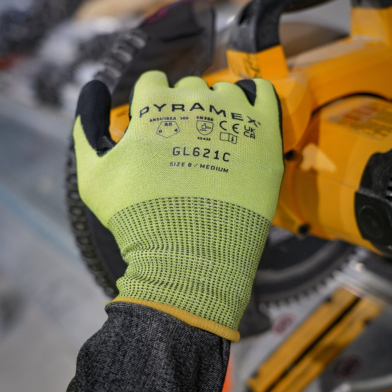 Pyramex GL621C A5 Cut-Resistant Micro-Foam Nitrile Gloves worn while operating a saw