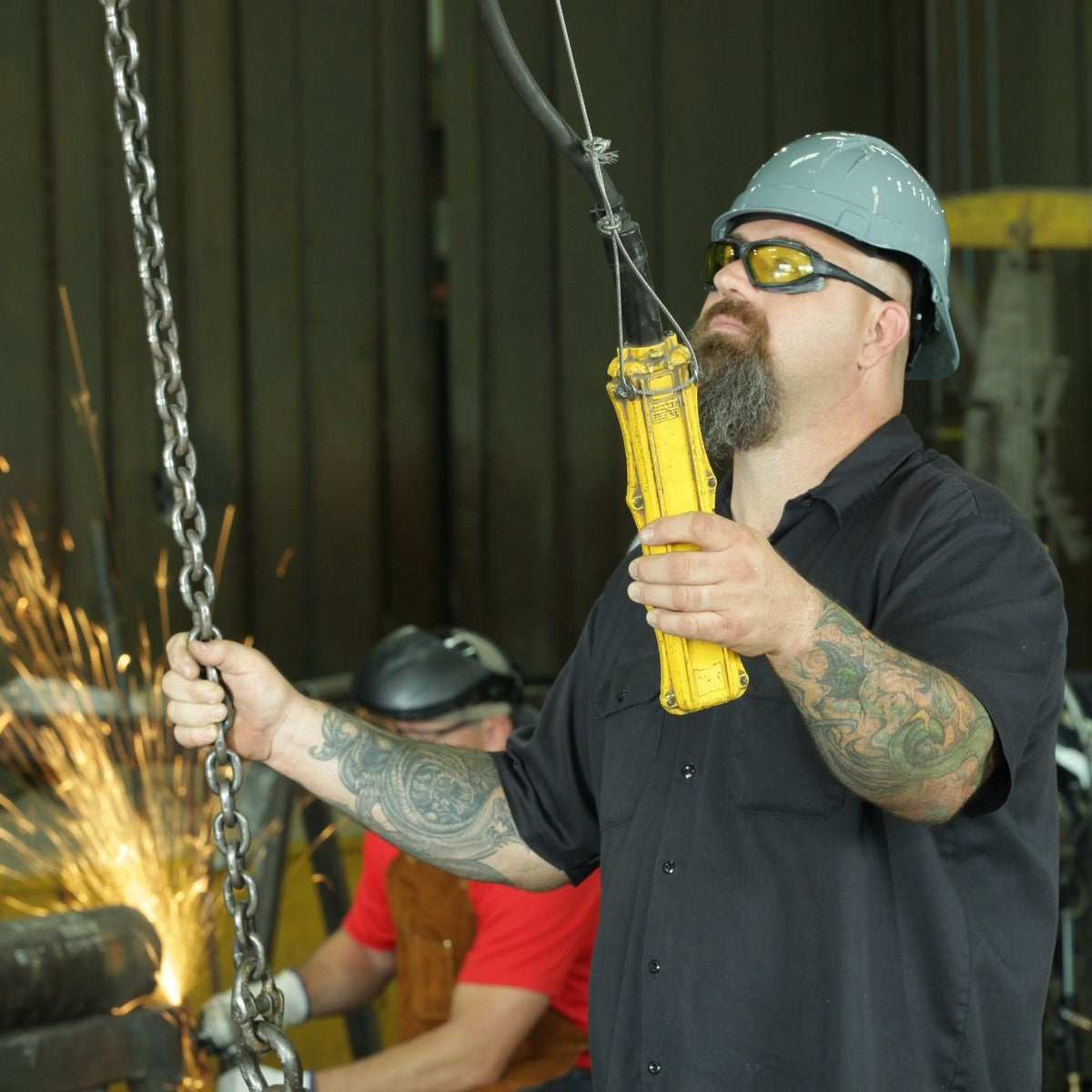 Pyramex Highlander Plus Safety Glasses Black Foam-Lined Frame Amber Anti-Fog Lens worn by worker with hard hat