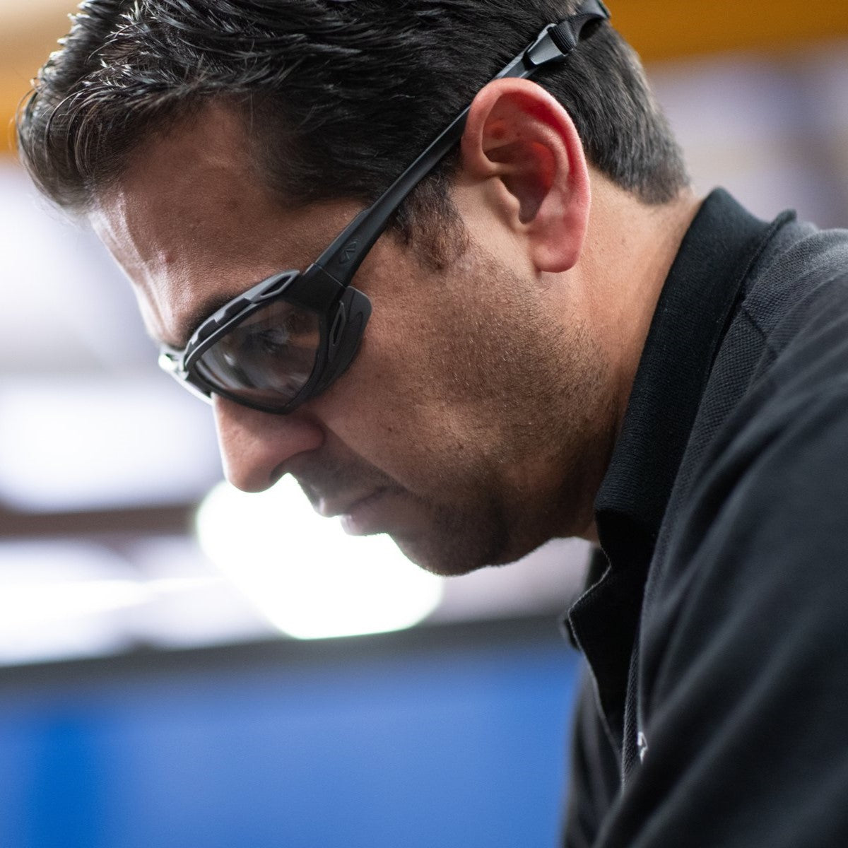 Pyramex Highlander Plus Safety Glasses Black Foam-Lined Frame Clear Anti-Fog Lens worn by worker