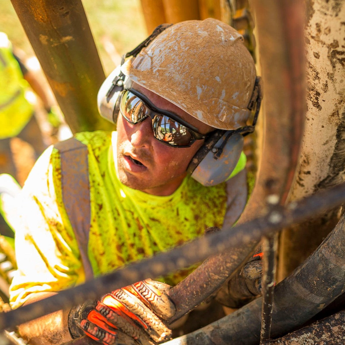 Pyramex Ridgeline Cap Style Vented Hard Hat White worn by muddy worker