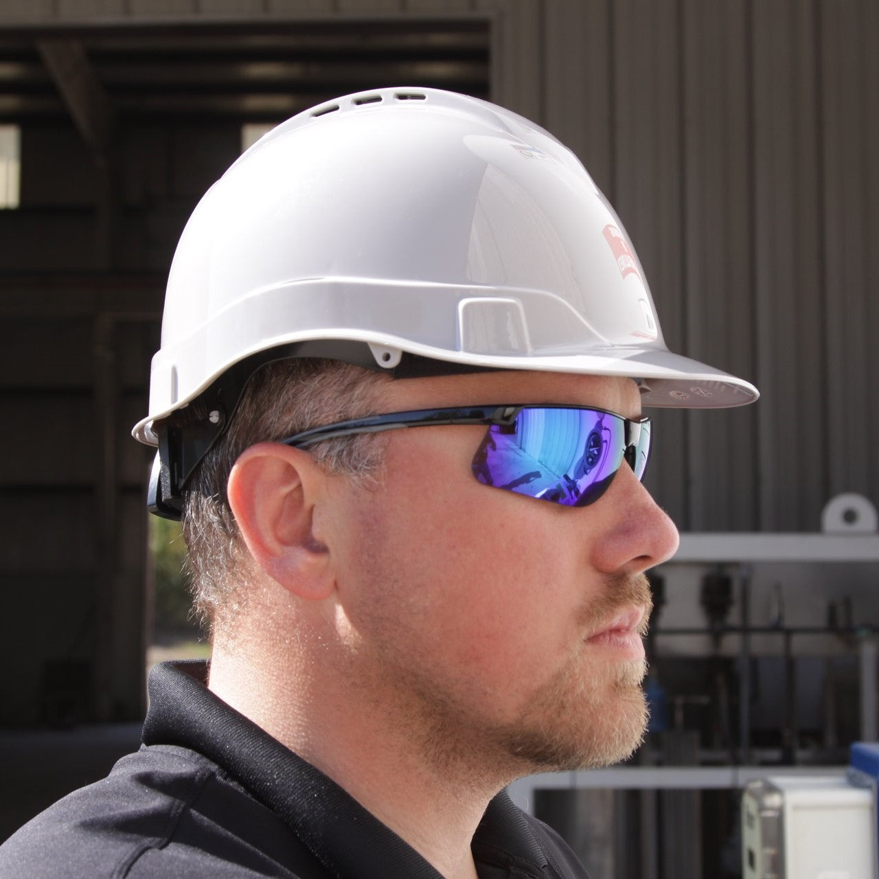 Pyramex HP44110V Ridgeline Vented Hard Hat Cap Style worn by a worker with safety glasses