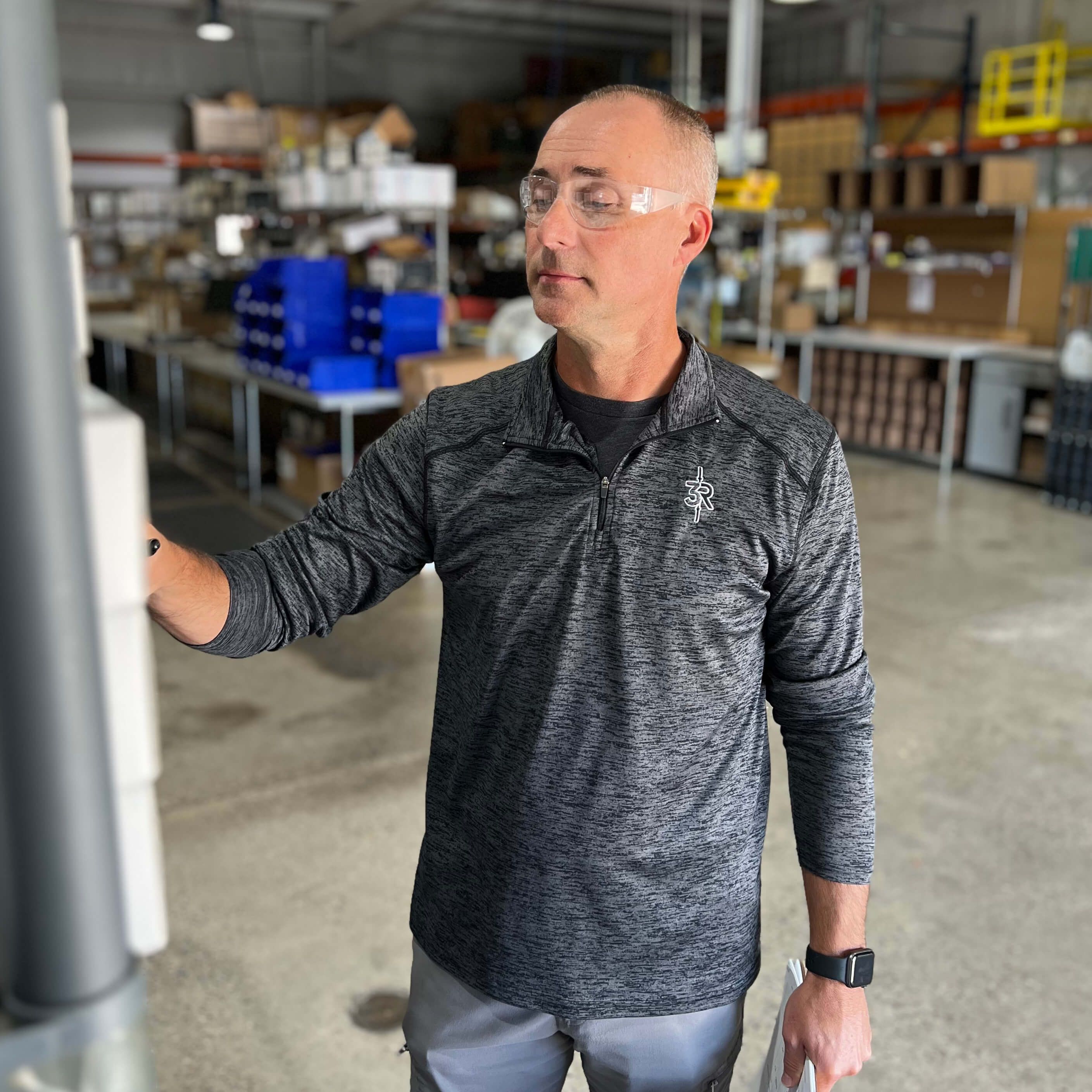 Warehouse worker using Pyramex S4110R Intruder Readers Bifocal Safety Glasses with Clear Lenses