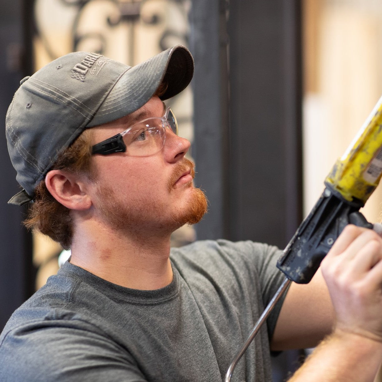 Pyramex Trulock Safety Glasses Black Temples with Clear Lenses worn by construction worker