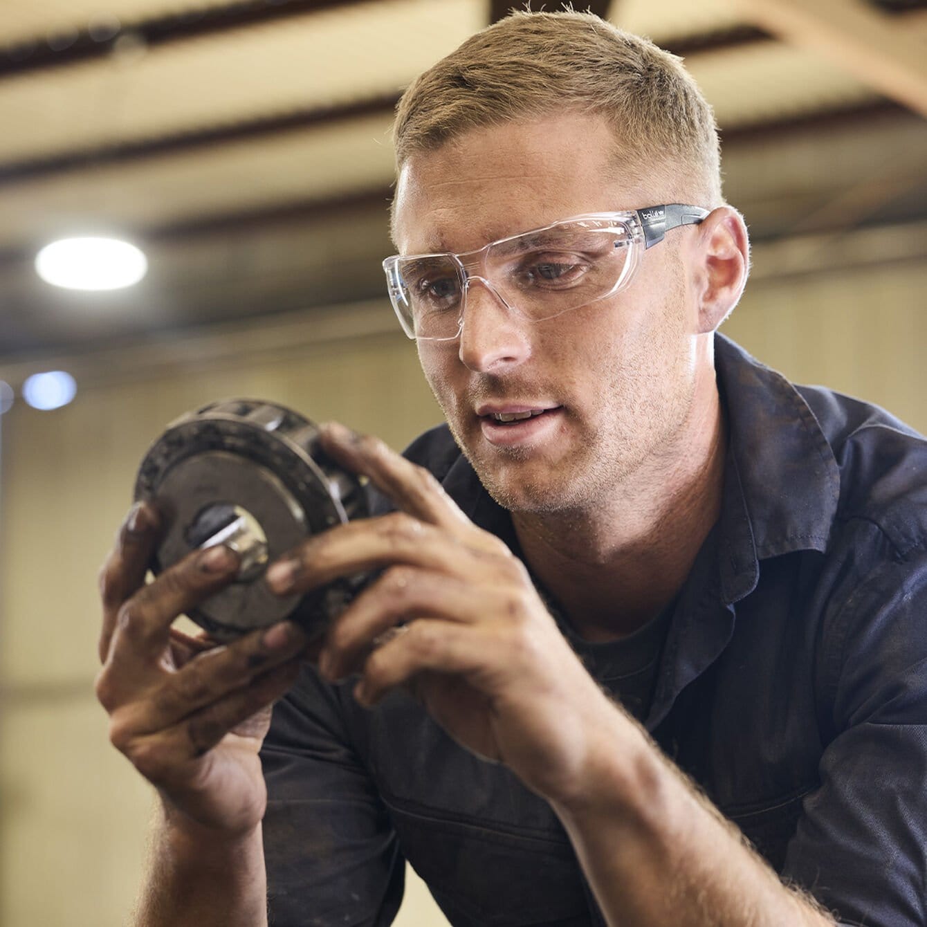 Bolle Swift Safety Glasses worn by a mechanic