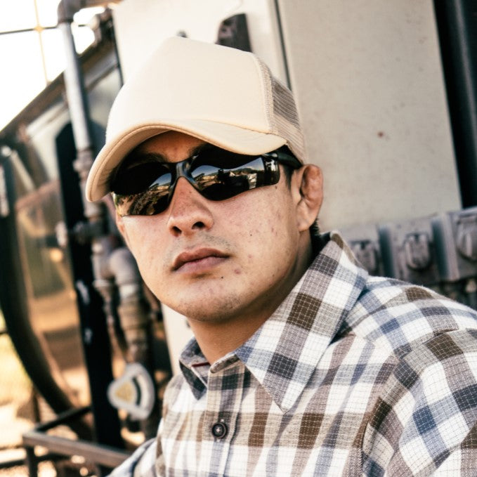 Worker wearing MCR Safety BK1 Safety Glasses