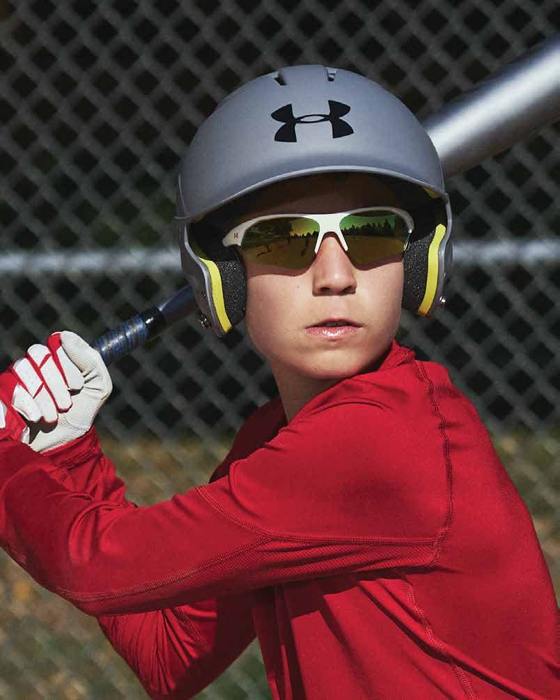 Under Armour Playmaker Jr Sunglasses with White Frame and Baseball Orange Lens UA7000S-IXN-50 - Child Wearing Front View